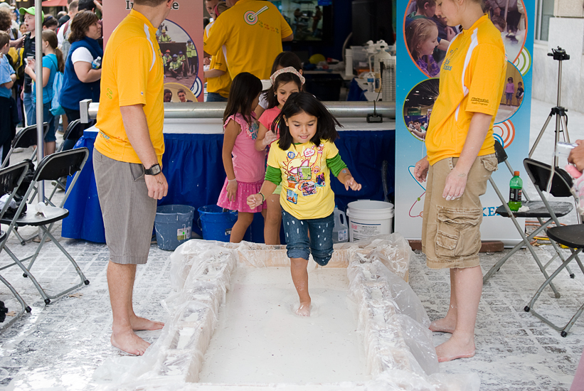 kids running through cornstarch water - DC event photographer