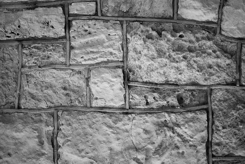 textured brick in black and white moody mansion