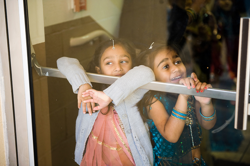 little girls watching bride's family come inside