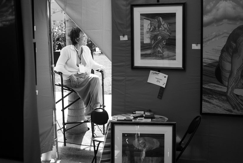 lady sitting behind her art stall