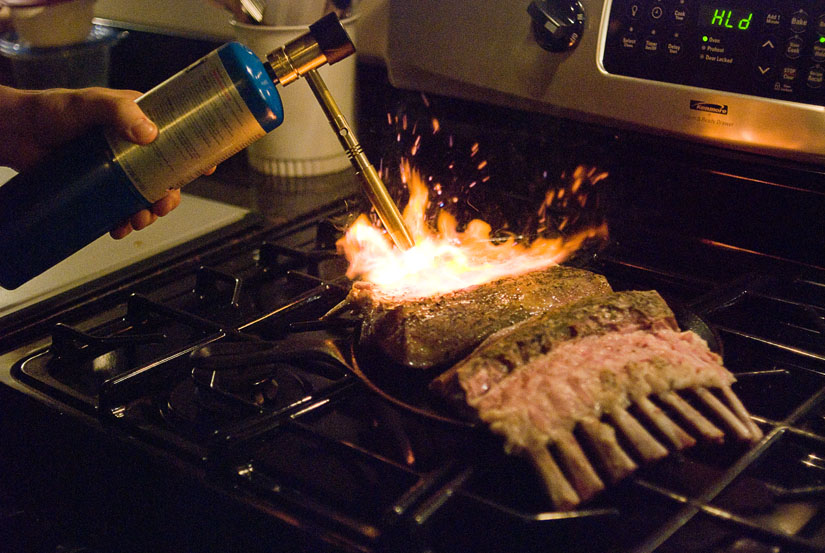 rack of lamb being toasted