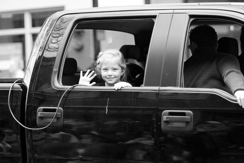 little girl in a truck in black and white