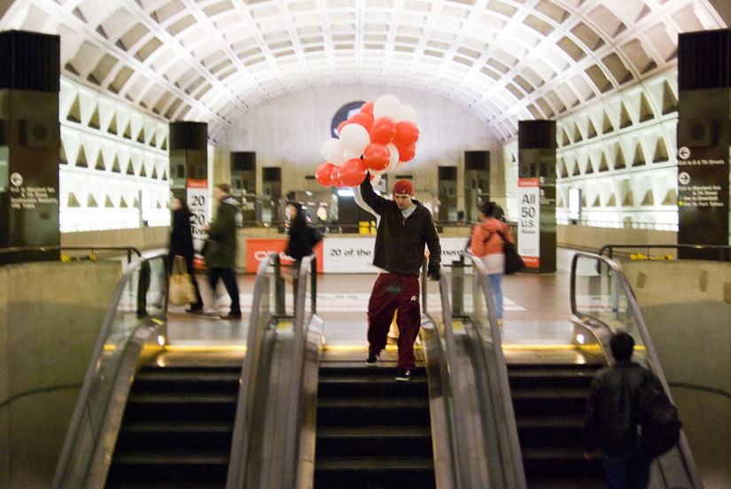 dudes with balloons in the metro station