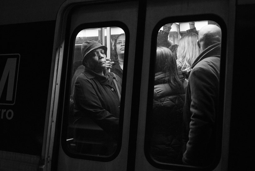 woman in the doors of a metro train