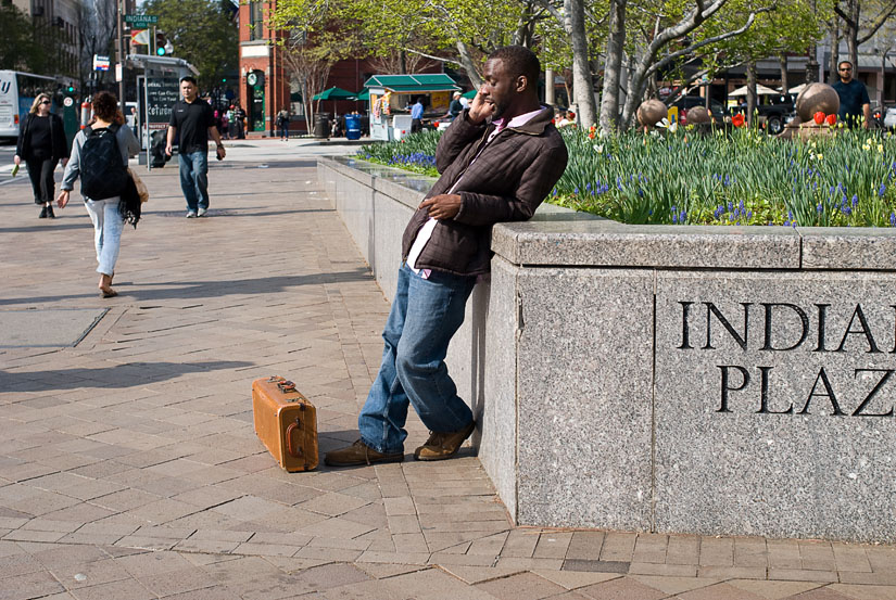 guy leaning on the street