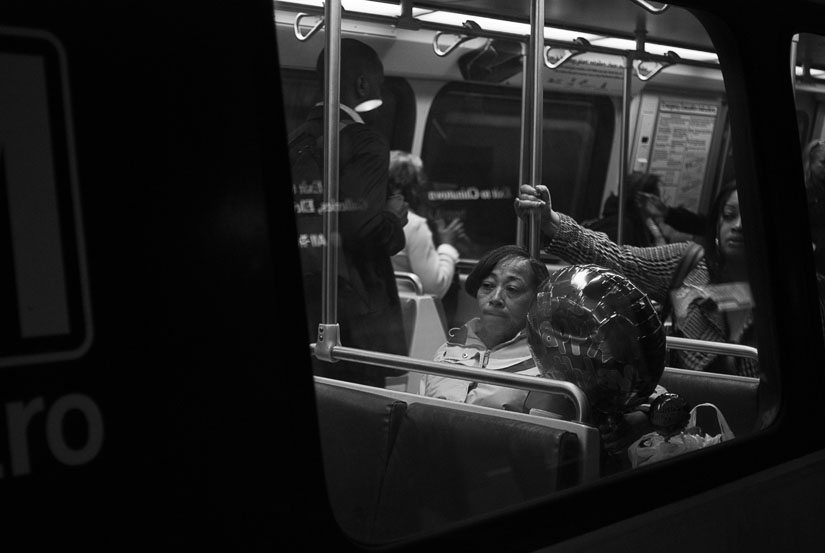 lady with balloon in the metro