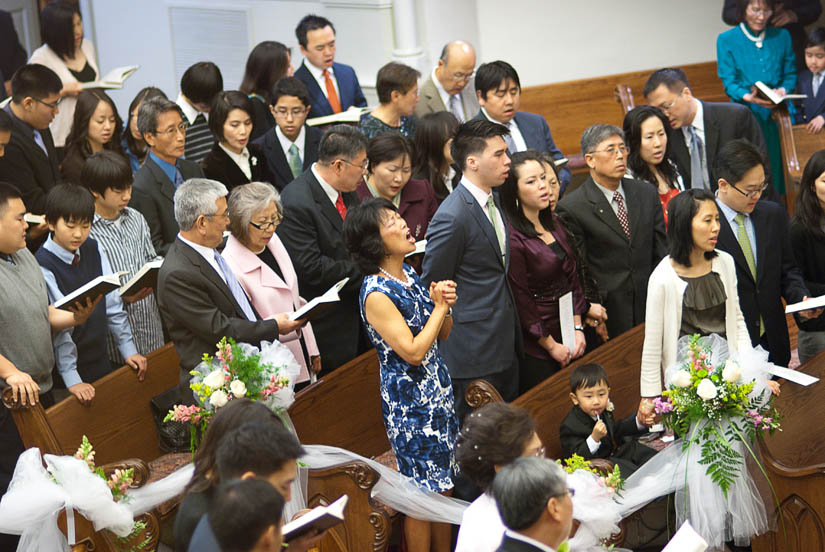 wedding guest sings during the ceremony at capitol Hill baptist