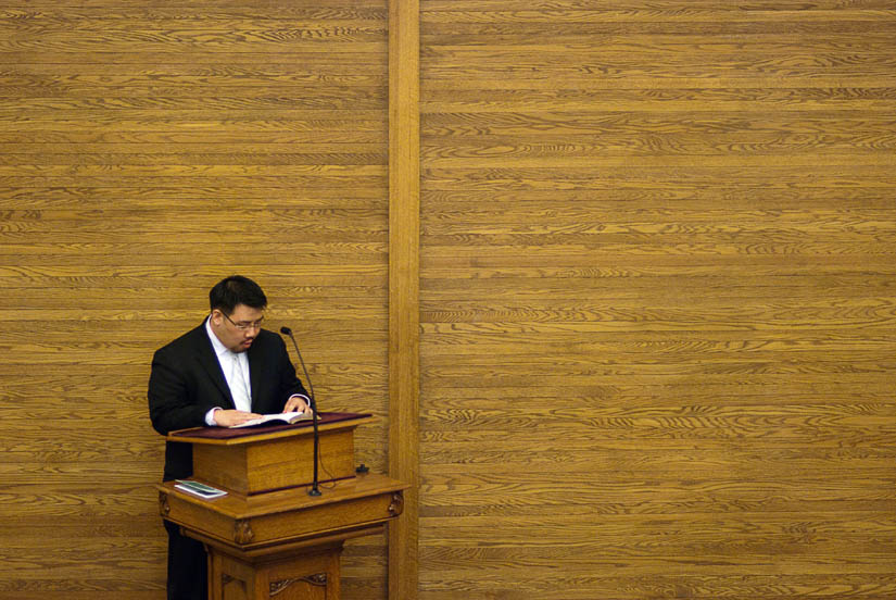 best man gives speech during church ceremony