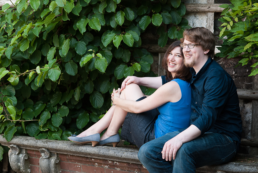 sitting engagement photos with leaves