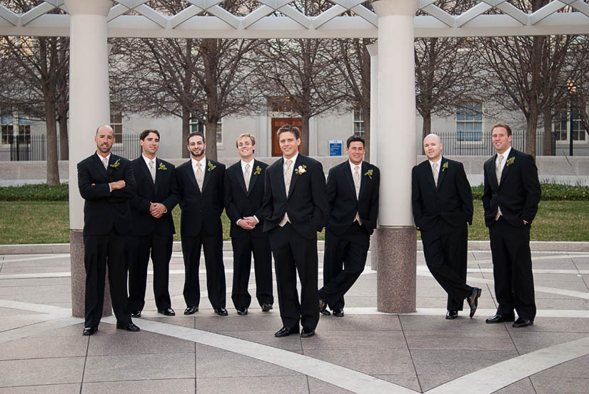 groom with groomsmen in park near church