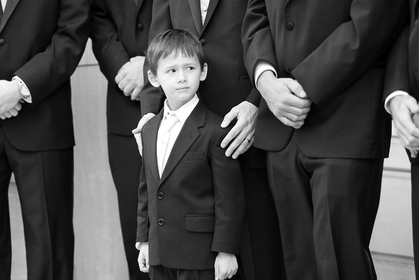 little boy with groomsmen