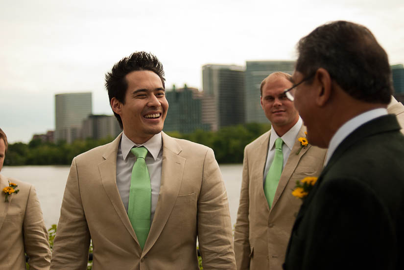 groom with green ties and linen suits