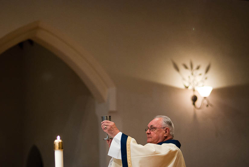 priest conducting wedding ceremony at dahlgren chapel