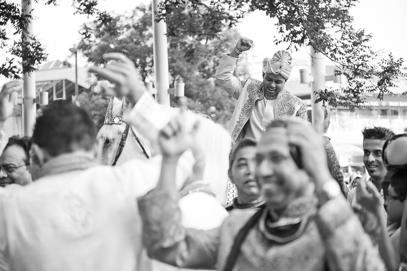 black and white photo of groom on horse