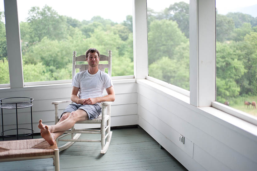 groom sitting on porch in nellysford, va