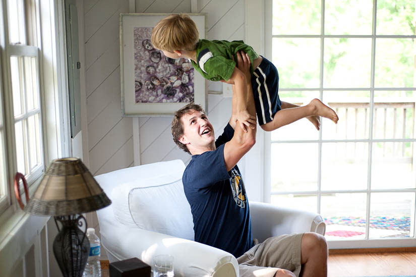 best man plays with a little boy at wedding