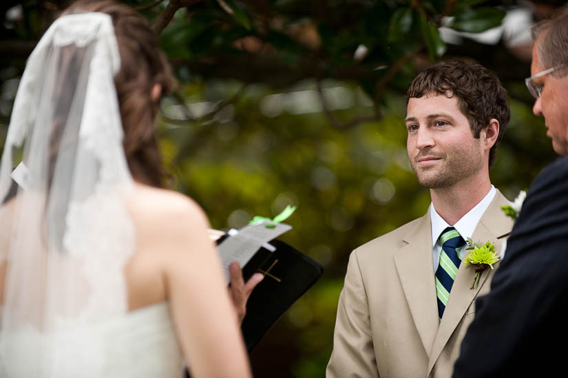groom looks adoringly at bride during ceremony