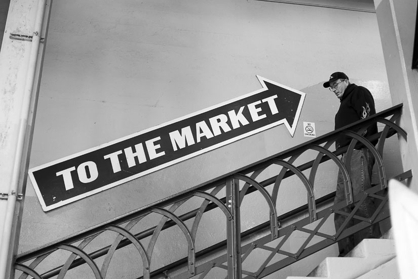 to the market sign with guy in seattle