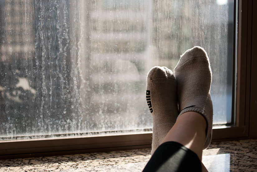 feet on window sill, backlit