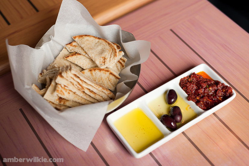 olive oil olives pita bread at cava restaurant