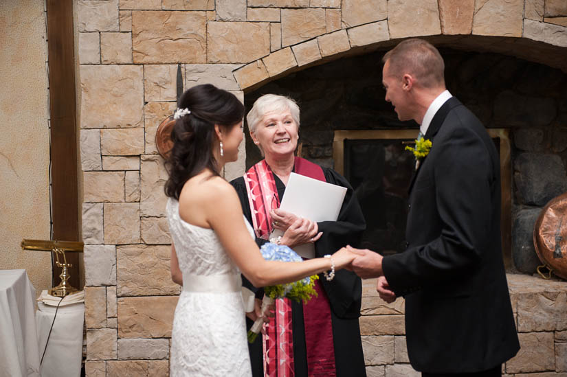 olivia and eric with officiant