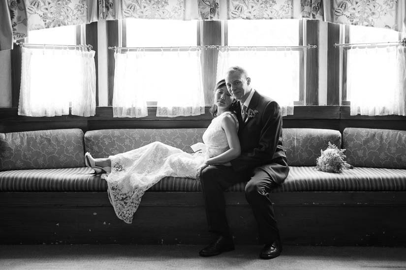 bride and groom on french couch