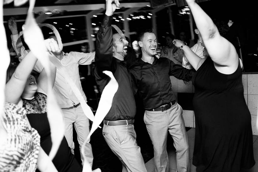 grooms dancing at reception