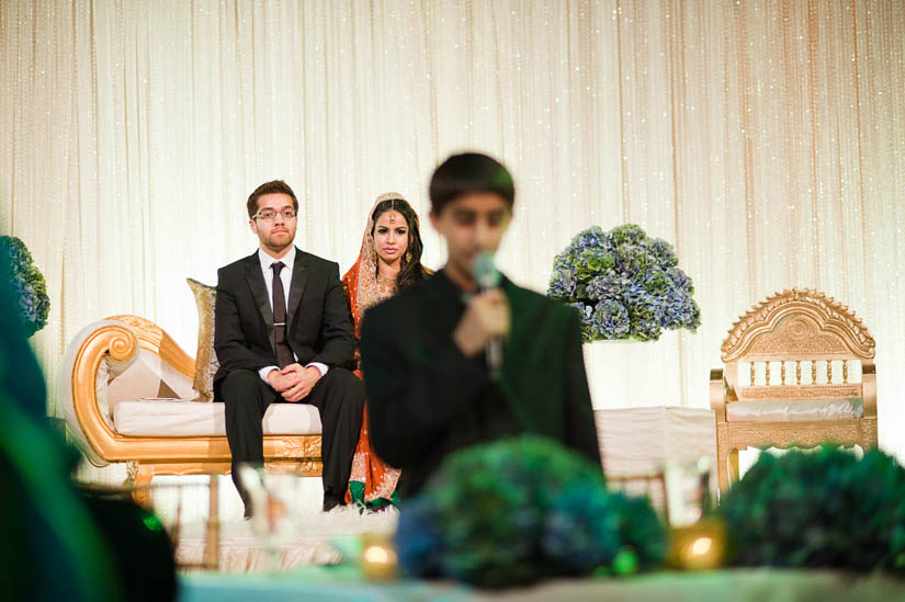 bride and groom listening to koran speech