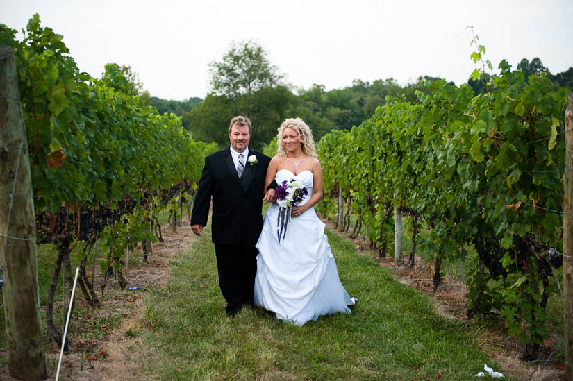 father of the bride with bride in grape vines