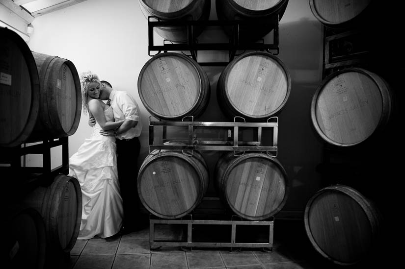 wedding portrait in vineyard barrel room