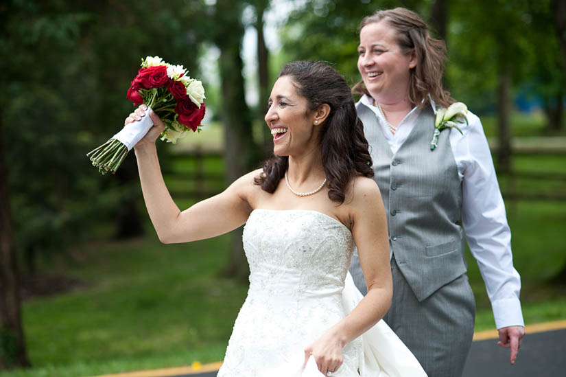 bride laughing with bouquet