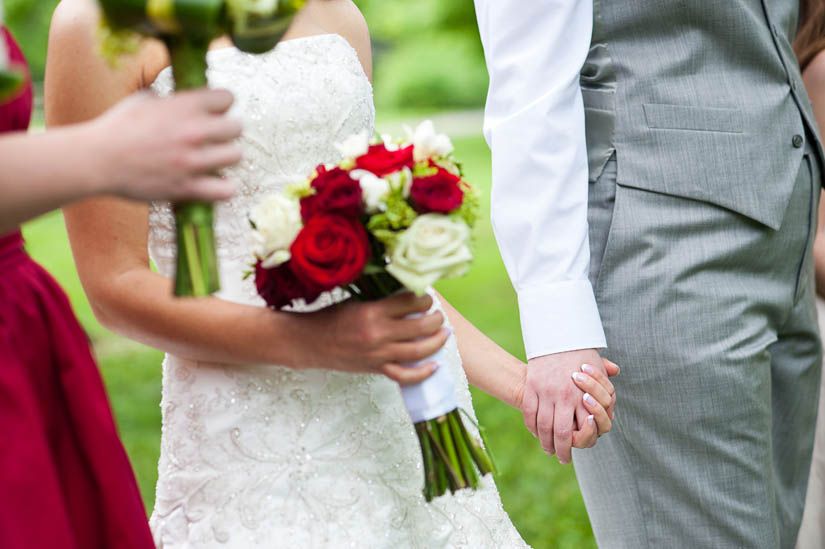 brides holding hands during portraits