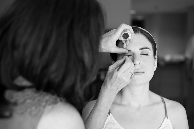 bride having her makeup done