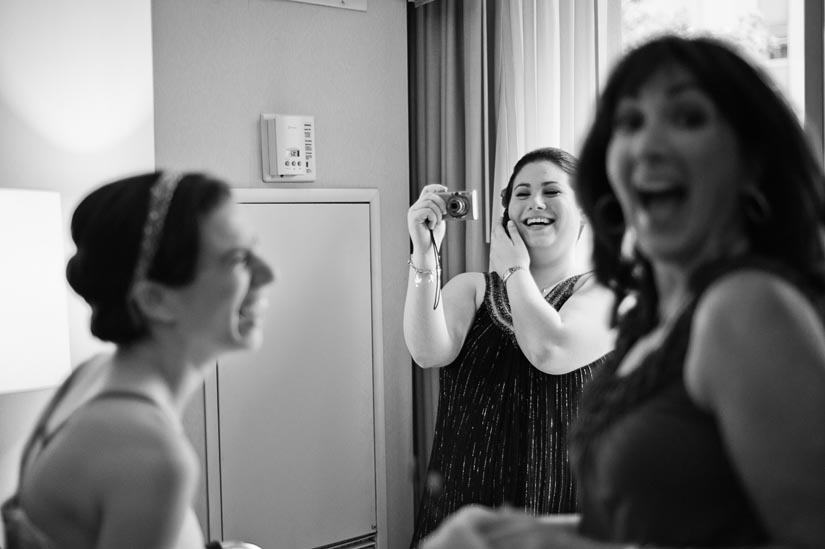 bride and her sister laughing before the wedding