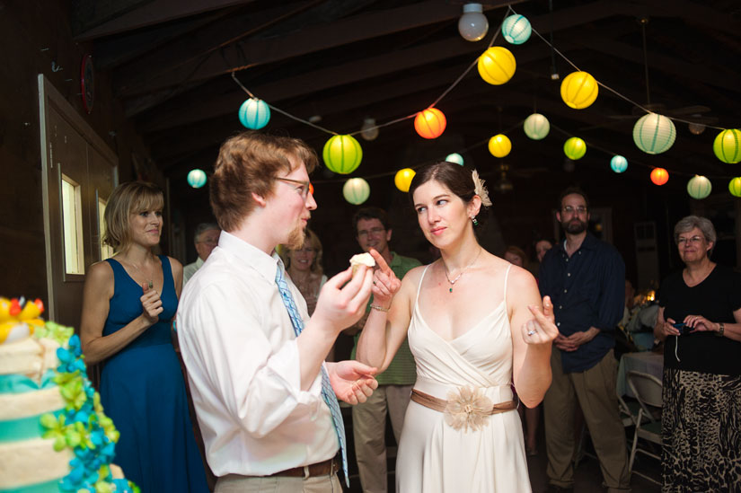 bride and groom cutting cake