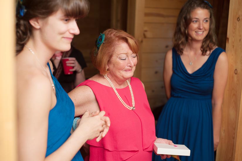 mom tearing up at seeing bride in wedding dress