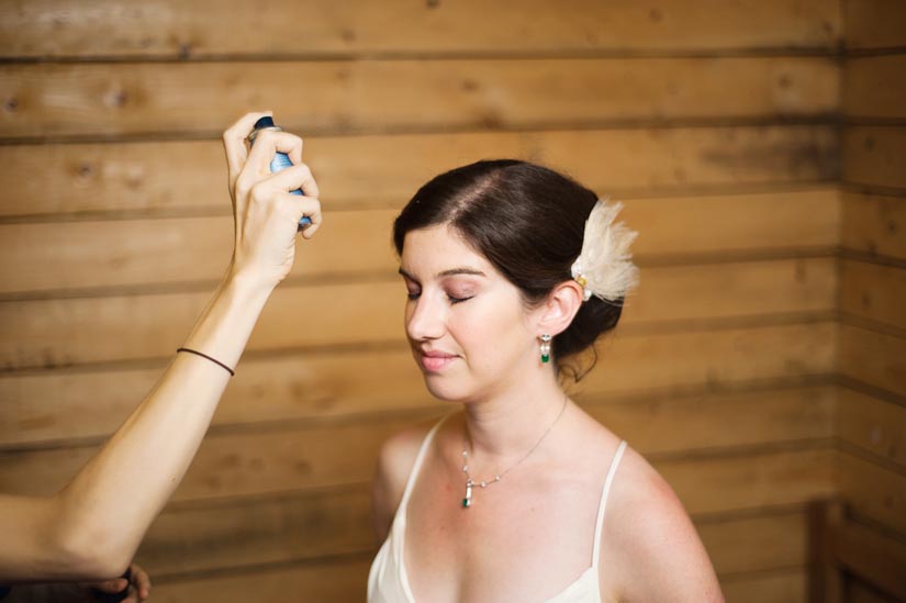 bride getting hairsprayed