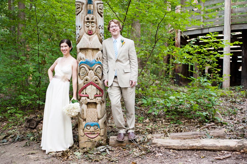 bride and groom witih totem pole