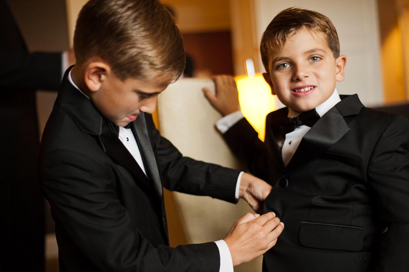 little boys getting ready for the wedding