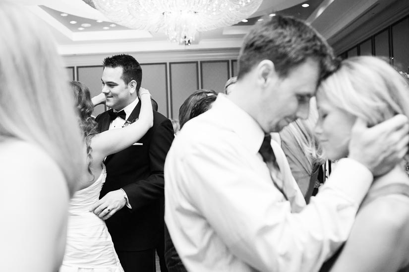 bride and groom dancing with friends