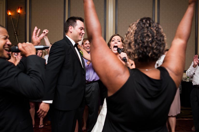 bride singing at wedding reception