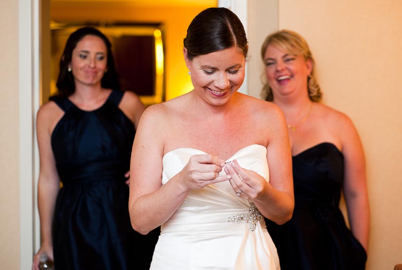bride laughs with bridesmaids