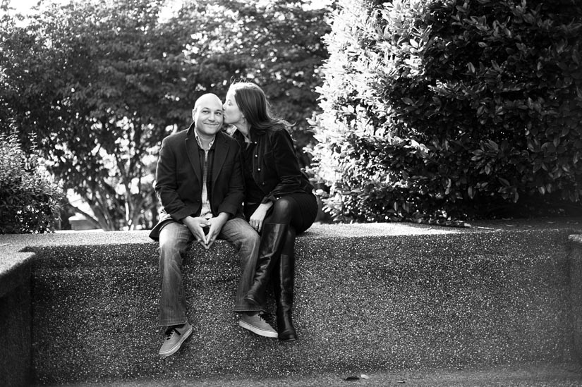 engaged couple kissing in meridian hill park
