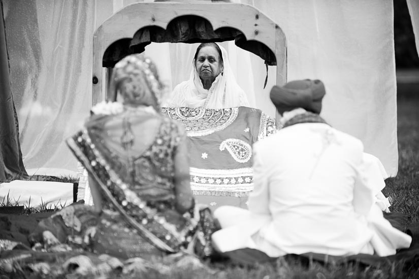 reader looks over the bride and groom
