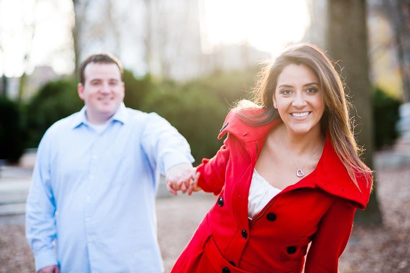 girl in red coat during engagement session