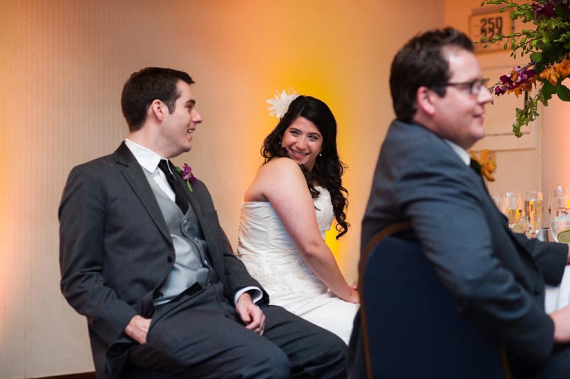 super-cute bride and groom during speeches