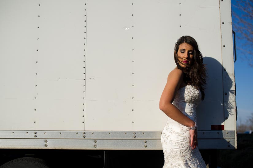 beautiful bride in front of a truck