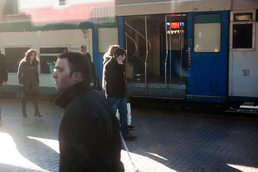 people near trains in rome, italy