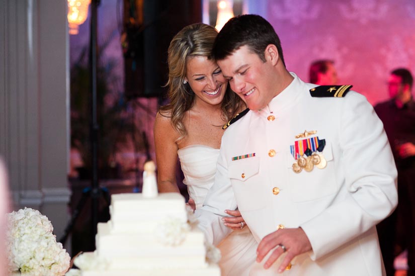 cutting the cake with incredibly beautiful couple