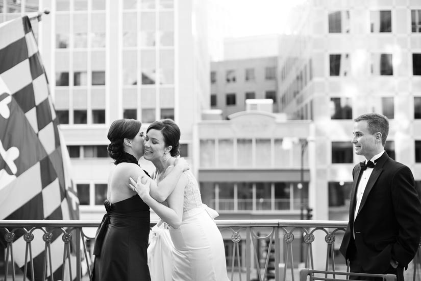 bride and her sister on the mayflower suite balcony